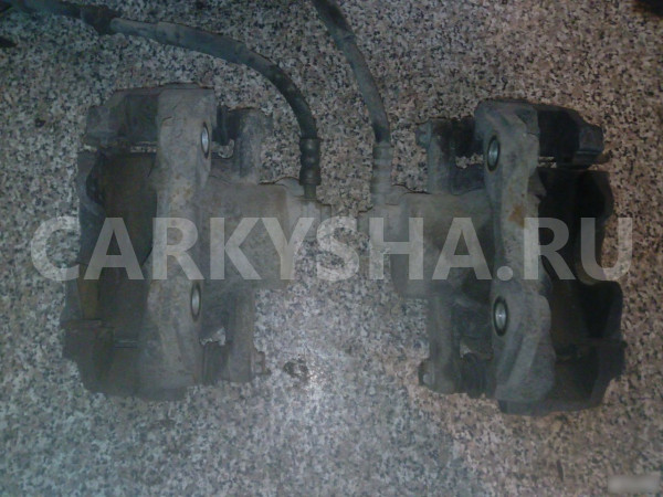 Суппорт тормозной Фольксваген Поло Volkswagen Polo оригинальный номер 1K0615123D 1K0615124D